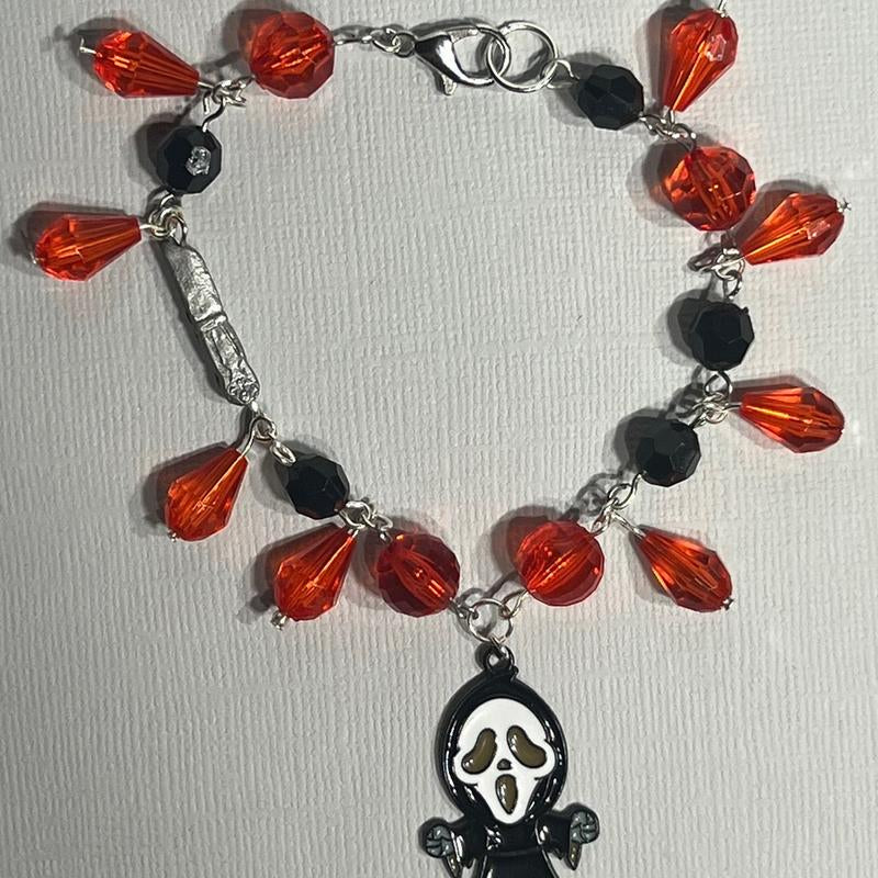 Scream Inspired Charm Bracelet Featuring Figure and Knife Charm