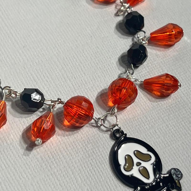 Scream Inspired Charm Bracelet Featuring Figure and Knife Charm