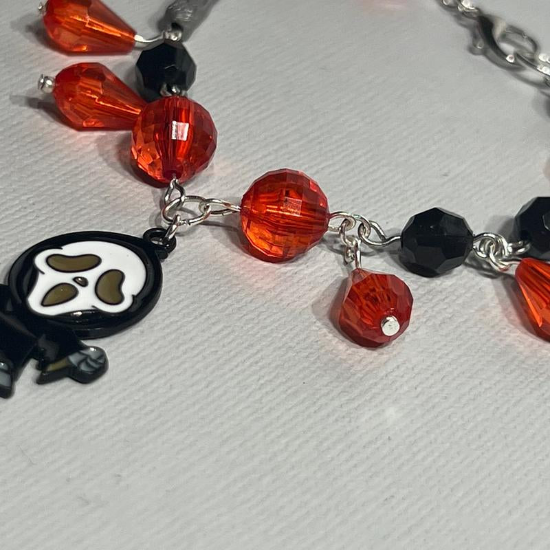 Scream Inspired Charm Bracelet Featuring Figure and Knife Charm